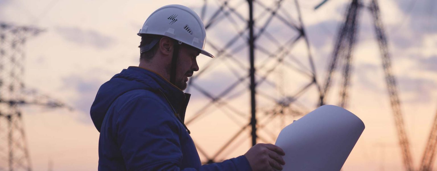 Worker looking at plans