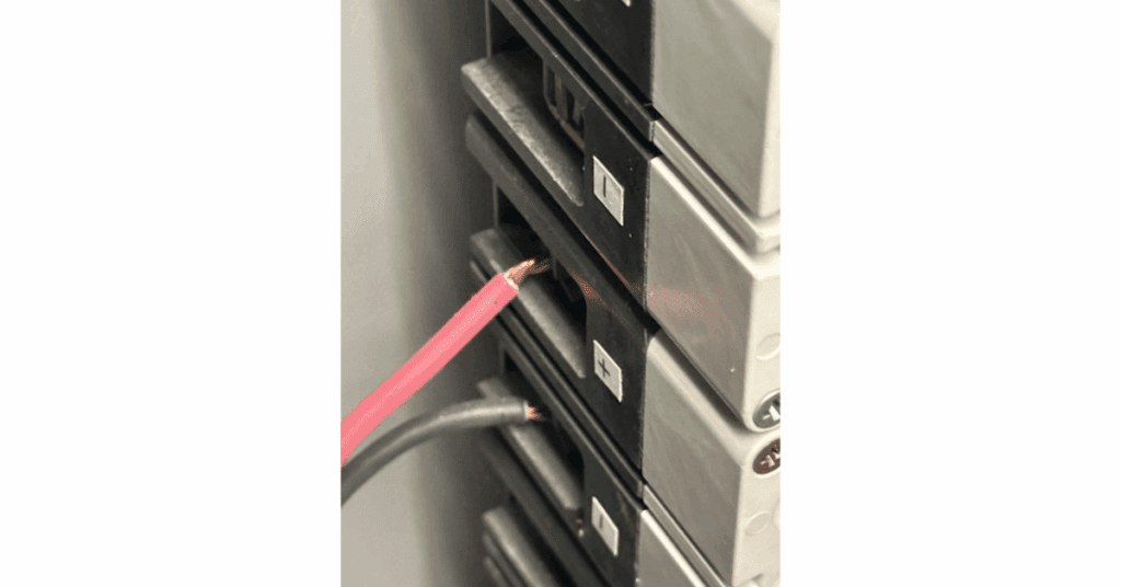Breaker Slot Wiring Hazard: Exposed Conductor and Loose Termination Prevented Electrical Failure